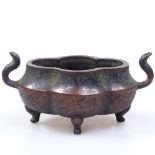 A Chinese patinated bronze censer on 4 feet with seal mark, length 18cm overall