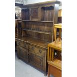 A 1920s oak 2-section dresser, W137cm, H195cm