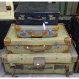 2 small briefcases, and 2 canvas covered suitcases