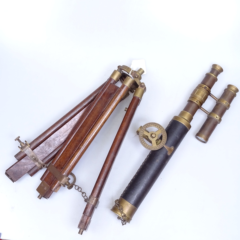 An Antique leather-covered brass telescope with sight, and adjustable brass-mounted wooden tripod by