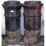 A pair of treacle glazed octagonal chimney pots, H75cm