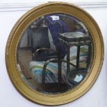 A circular gilt-framed bevelled-edge wall mirror, W63cm