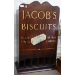 A Vintage stained wood shop dispenser advertising Jacob's Cream Crackers, with gilded lettering,