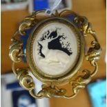 A Victorian gilt-metal brooch, with carved ivory stag mourning panel and hair panel to the reverse