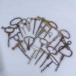 A collection of Vintage metal corkscrews, including brass-handled