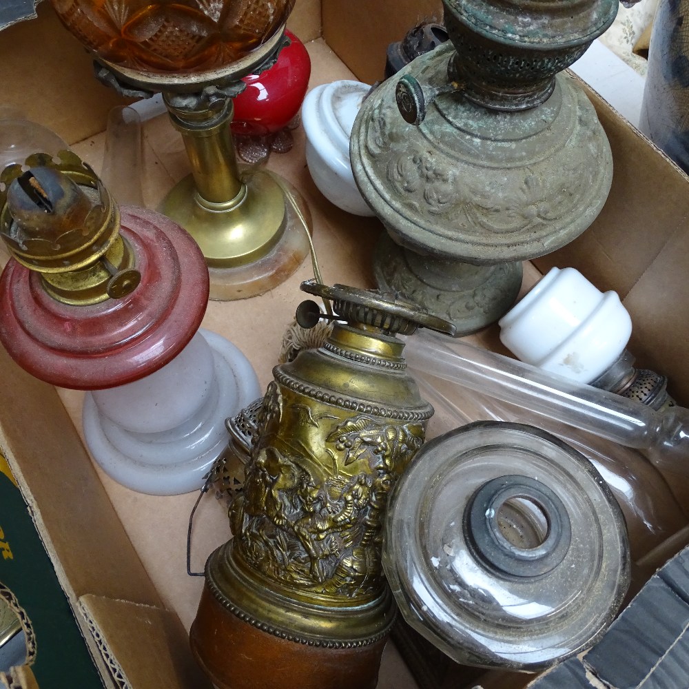 A brass oil lamp with amber glass font, and other oil lamps and chimneys - Image 2 of 2