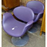 A pair of Junior Tulip chairs in purple leather on swivel base, by Pierre Poulin for Artifort