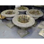 A set of 4 weathered concrete 2-section garden urns, H40cm