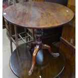 A Georgian mahogany circular tilt-top table on tripod base, W74cm