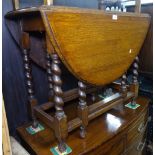 An oak oval barley twist gateleg table, W87cm