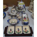 A Quimper teapot, snacks dishes, egg cups etc