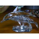 A boxed Swarovski pair of leaping dolphins, length 11.5cm