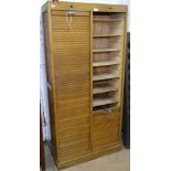 A 1930s oak double-fronted tambour filing cabinet, W83cm, H177cm