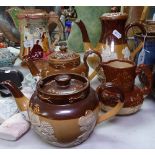 Doulton Harvest Ware teapots, a jug, and a coffee pot, height 21cm