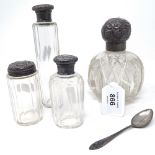 A cut-glass and silver-mounted scent bottle, 3 silver-topped toilet bottles, and a silver teaspoon