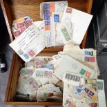 An oak box containing assorted stamps