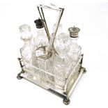 An Edwardian silver plated condiment stand, with 6 fitted bottles