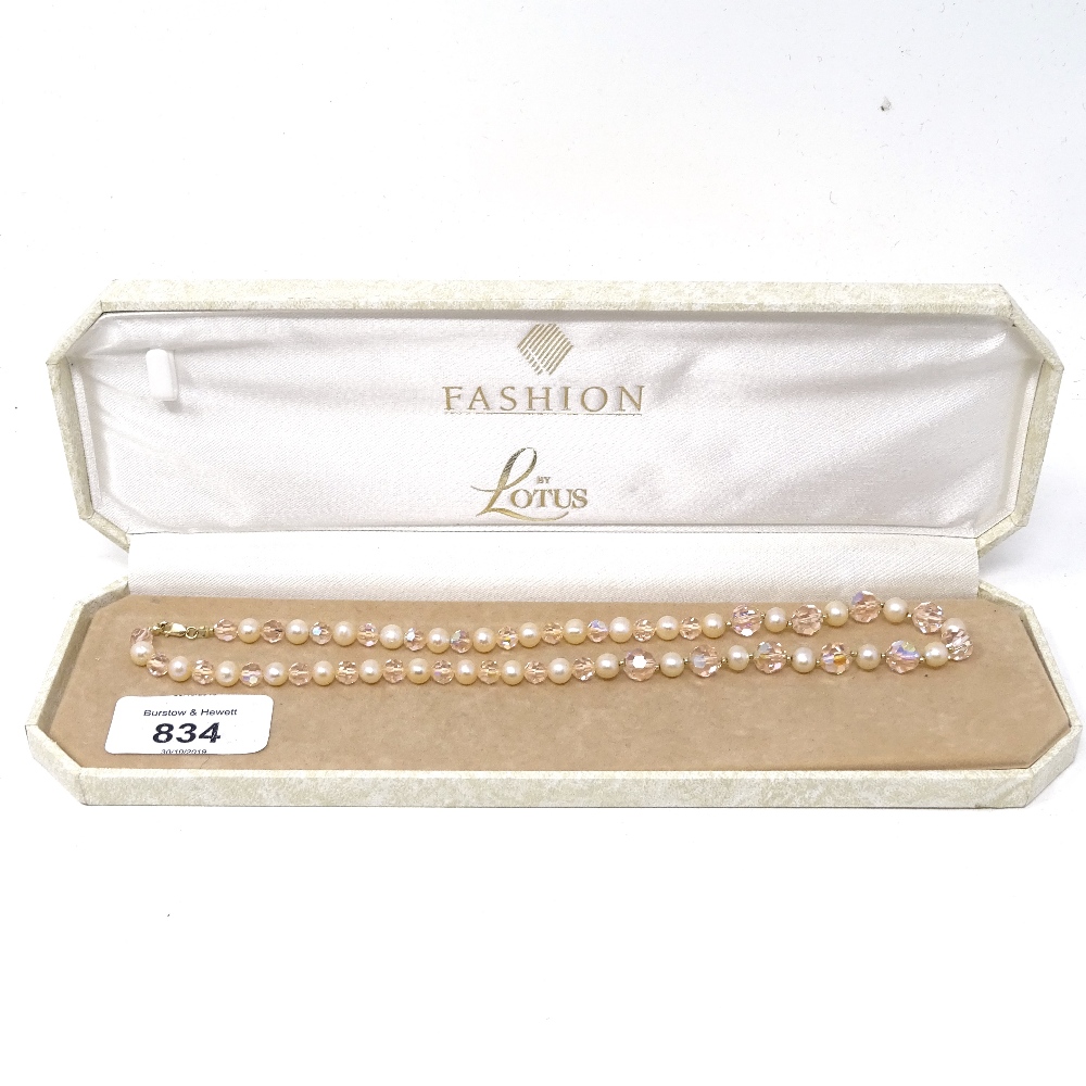 A string of pearls and beads with 14ct gold clasp