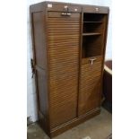 A 1930s oak double-fronted tambour filing cabinet, W83cm, H147cm