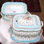 A Victorian porcelain soup tureen and cover on stand, and matching serving dish on stand