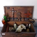 A voodoo box inscribed J Ledoc Opelousas, containing a skull, bones, bottles, crucifix etc