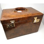 A good quality snakeskin effect travelling jewellery box, with a rising lid revealing a drawer