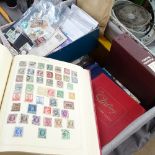 A large boxful of world stamp albums, loose stamps etc