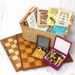 A travelling chess set, and books about chess