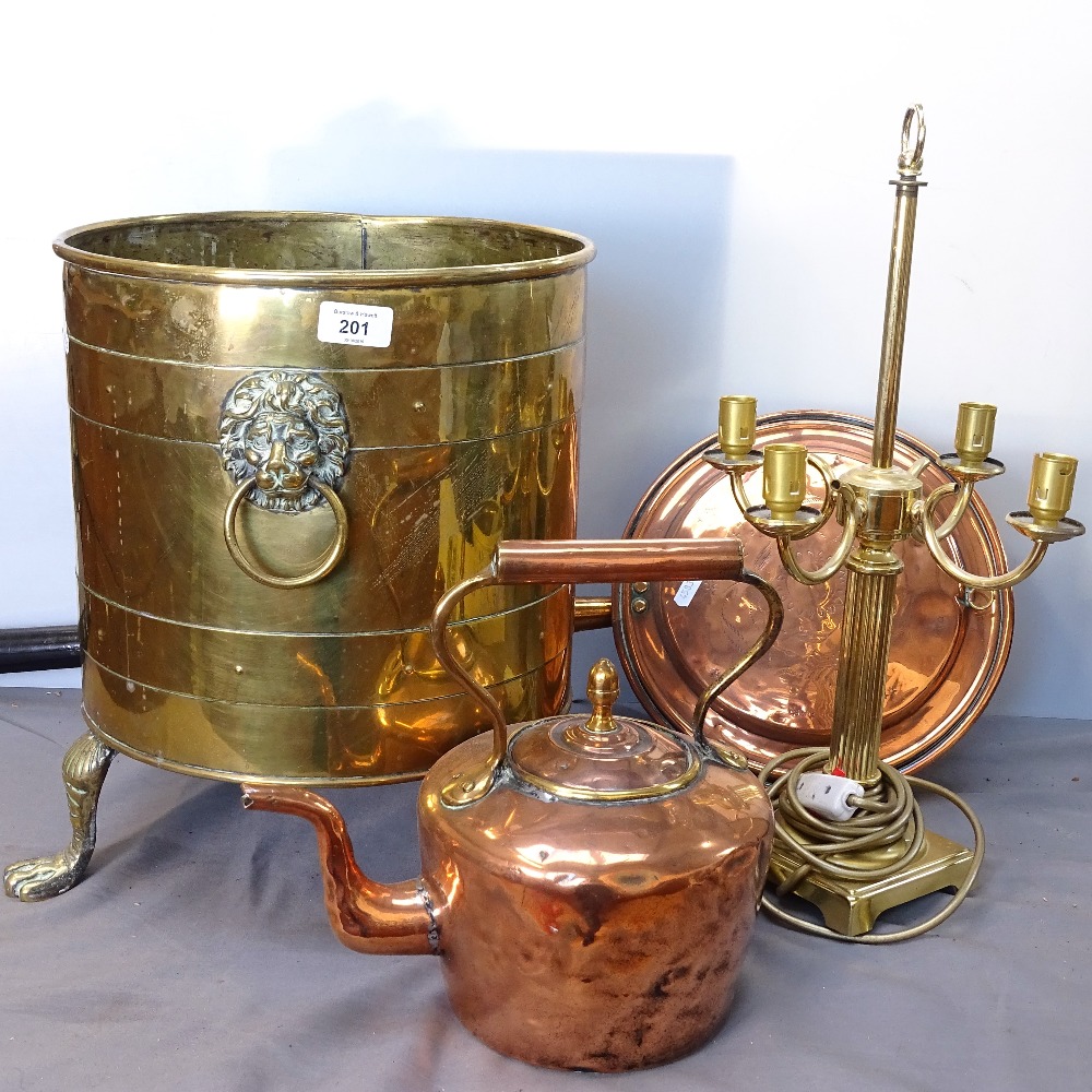 A brass coal bucket with lion mask ring handles, and paw feet, 39cm, a copper kettle, a bed-