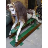 A painted rocking horse on stand, H105cm, L140cm