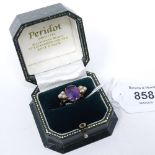 An unmarked gold amethyst and seed pearl dress ring