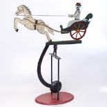 A novelty painted tin balance pendulum horse-drawn carriage toy, height 42cm