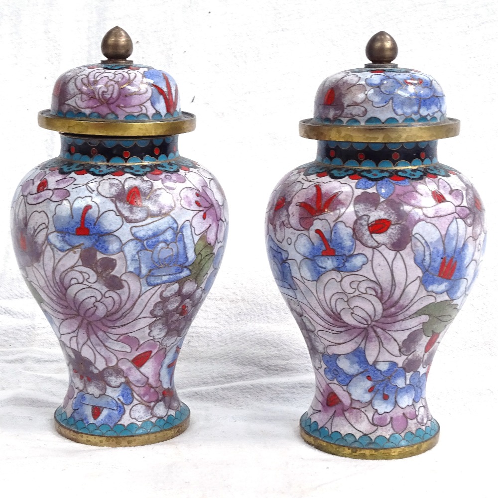A pair of cloisonne jars and covers with floral decoration, 18cm