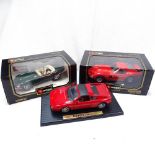 Boxed Burago Ferrari and Jaguar, and a Maisto Ferrari