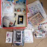 A box of world and British postage stamps