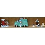 A shelf of Wallace & Gromit figures, including a van, boxed