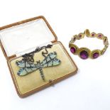 A red stone set and gilt-metal bracelet, and a green enamel dragonfly pendant and chain (2)