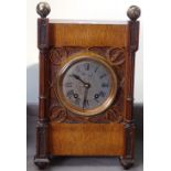 A carved oak-cased clock with 2-train movement, 37cm