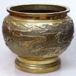 A large Chinese brass jardiniere, with turtle-design body, diameter 30cm