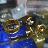 A 22ct gold wedding ring, 5.5g, and 3 18ct gold dress studs, 3g