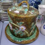 A George Jones Majolica Stilton dome on stand, with blossom decoration, height 28cm