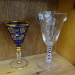 1953 Coronation goblet with coloured twist stem, 21cm, and a blue overlay gilded goblet