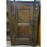 An Antique joined oak side cabinet, with single panel door, W70cm, H114cm