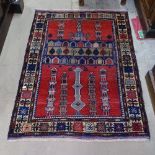 An Antique red ground Beluchi rug, 126cm x 91cm