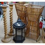 A pair of baskets, a pair of candle stands, and a lantern