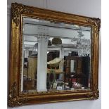 A gilt-framed bevelled-edge wall mirror, W76cm