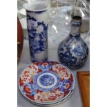 Chinese cylindrical blue and white vase, 26cm, Imari plates, and a Chinese bottle vase