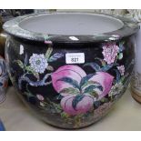 An Oriental jardiniere with floral and fish decoration, height 32cm