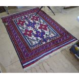 An Antique red ground Persian rug, 183cm x 131cm