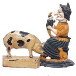 Painted cast-iron doorstop depicting Mrs Punch, 32.5cm, and a pig figure doorstop